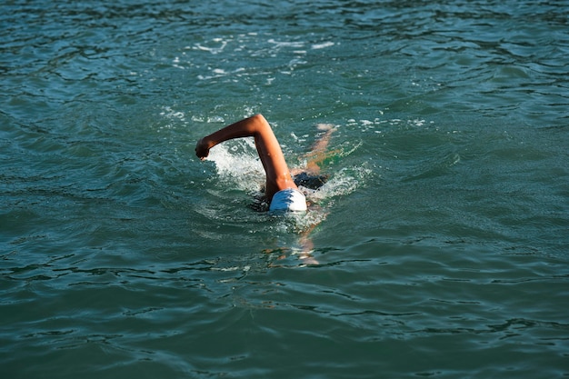 Free photo active young lady enjoying swimming