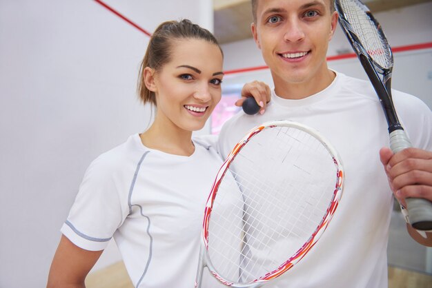 Active young people playing squash