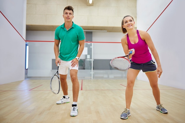 Active young people playing squash