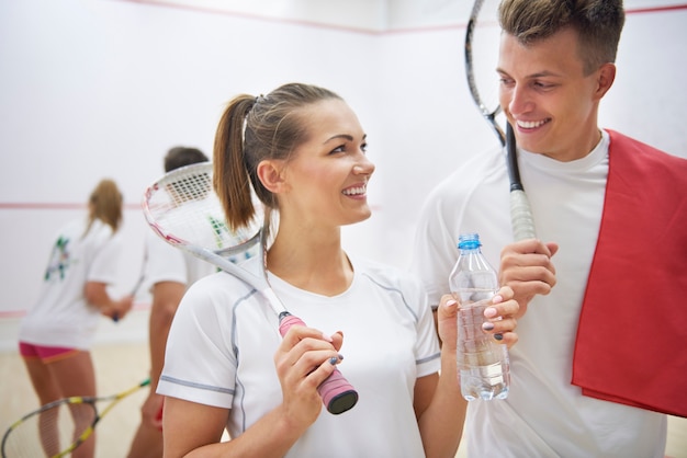 Active young people playing squash