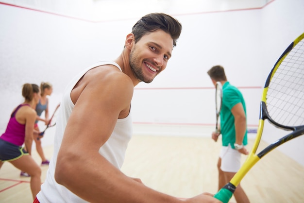 Active young people playing squash