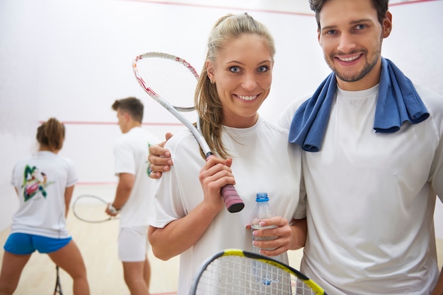 Free photo active young people playing squash