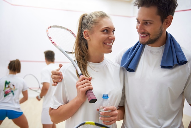 Active young people playing squash