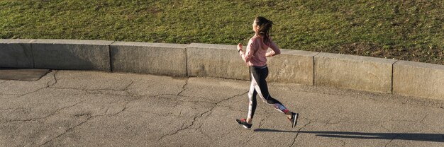 Active young woman jogging outdoor