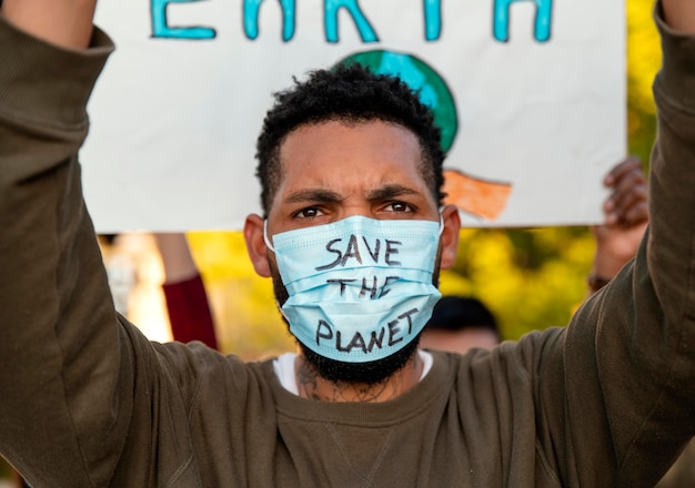 Activist protesting with face mask  close up