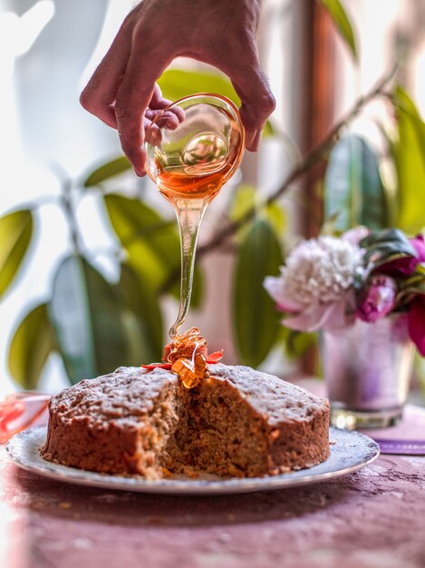 Adding maple syrup to the carrot pie