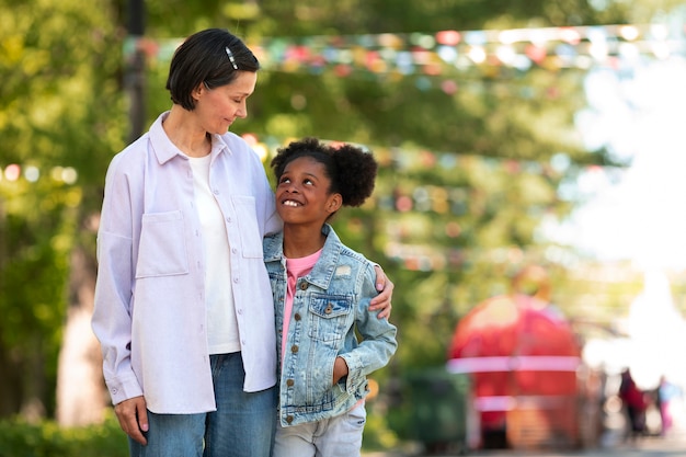 Free photo adoptive mother spending time with her daughter