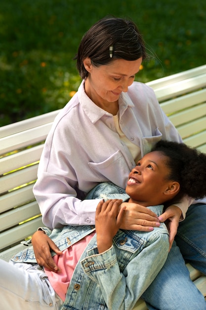 Free photo adoptive mother spending time with her daughter