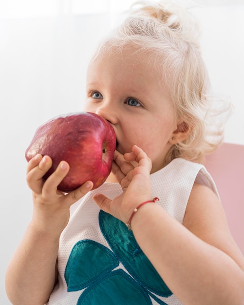 Free photo adorable baby playing with food