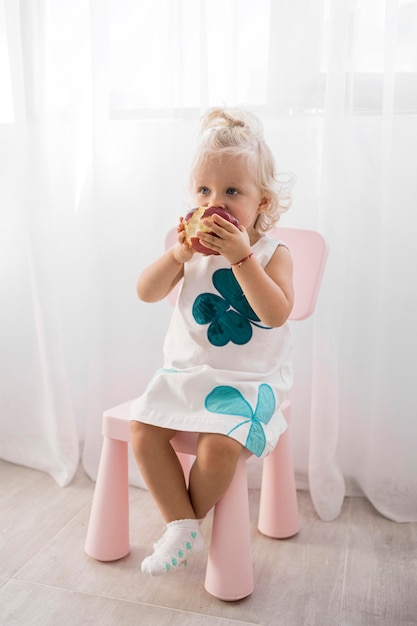 Free photo adorable baby playing with food