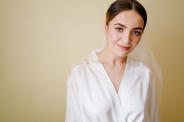 Adorable bride is getting ready in the morning