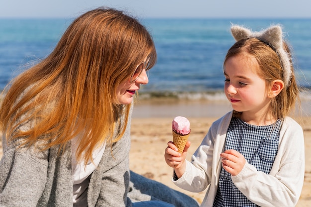 Adorable child holding ice cream