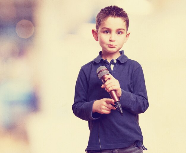 Adorable child holding a microphone