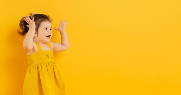 Free photo adorable child posing with copy space