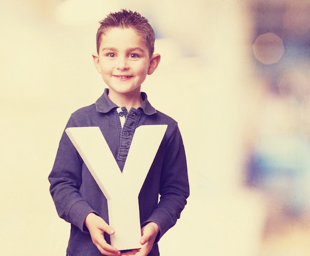 Free photo adorable child posing with letter y