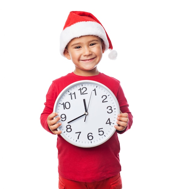 Adorable child with a clock