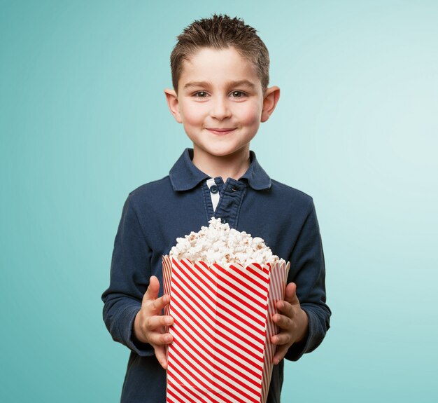Adorable child with popcorn