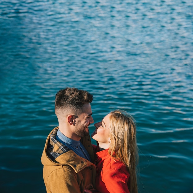 Adorable couple enjoying each other in sunlight