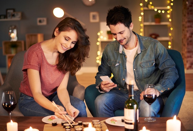 Free photo adorable couple having a meal at home