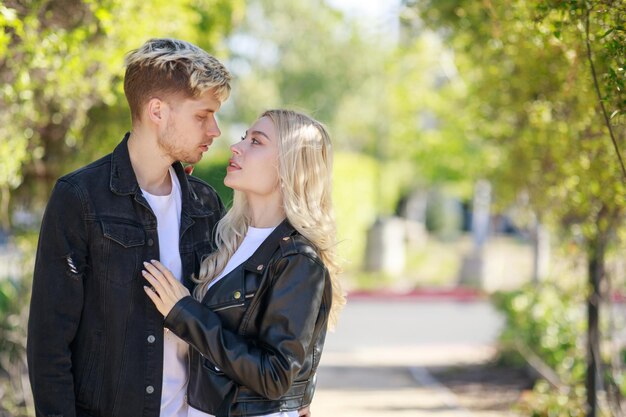 Adorable couple standing on and looking at each other