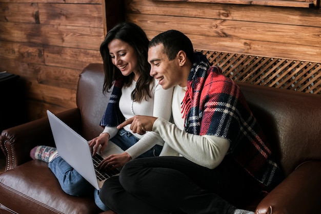 Free photo adorable couple together with a laptop