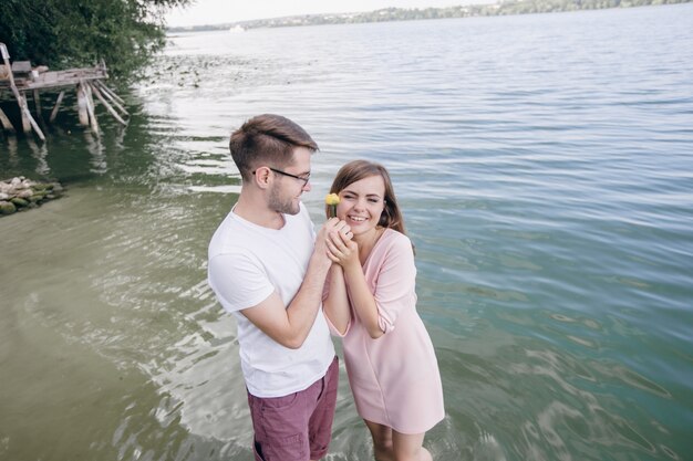 Adorable couple with a yellow flower