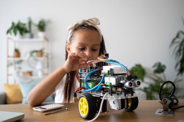 Adorable girl being passionate about robotics