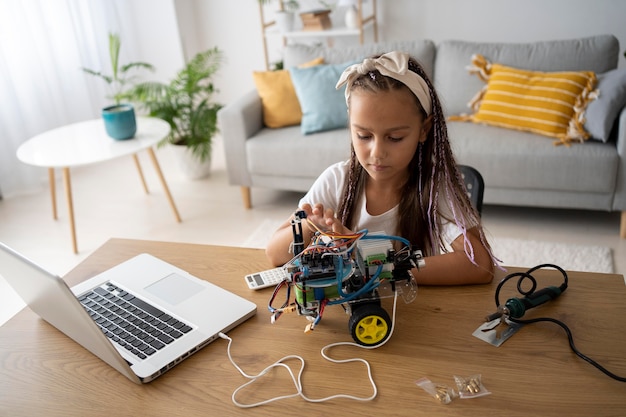 Free photo adorable girl being passionate about robotics