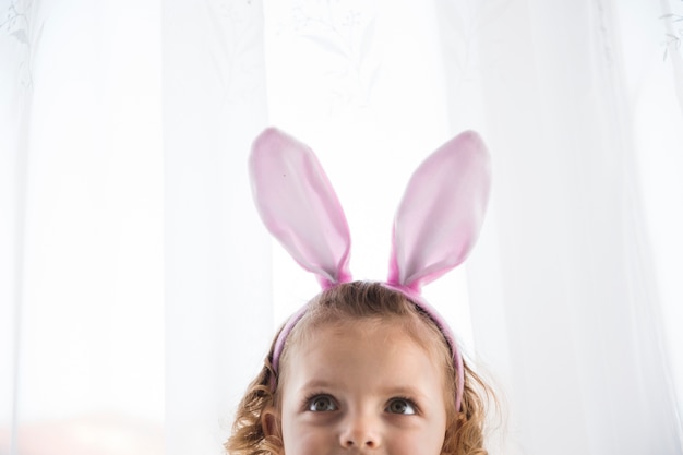 Adorable girl in decorative bunny eart