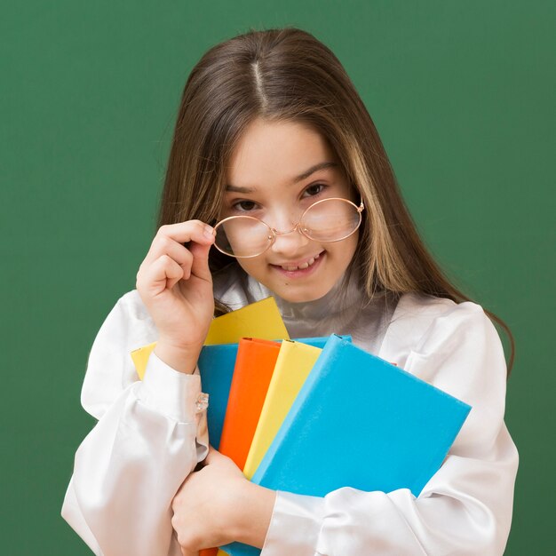 Adorable girl posing with glasses