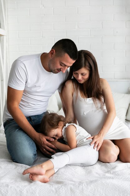 Adorable girl spending time with her parents