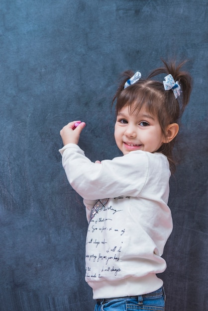 Adorable girl with chalk