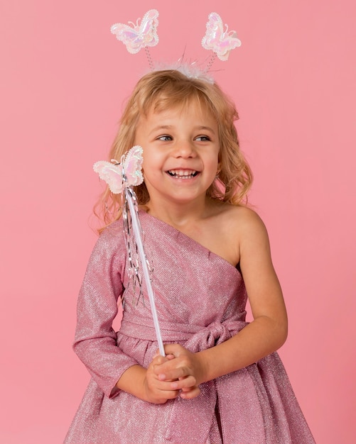 Free photo adorable girl with fairy costume