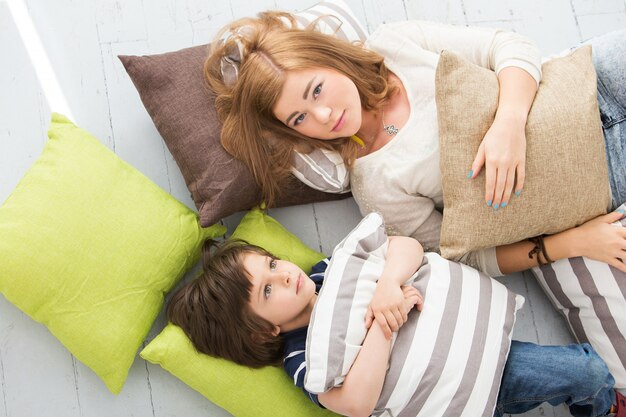 Adorable kid with mother on the floor