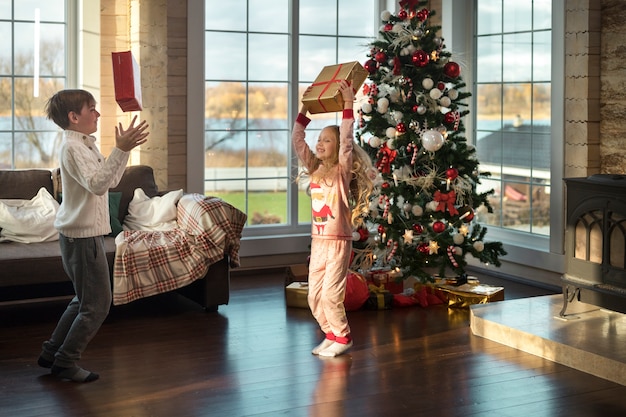 Free photo adorable kids enjoying the christmas day