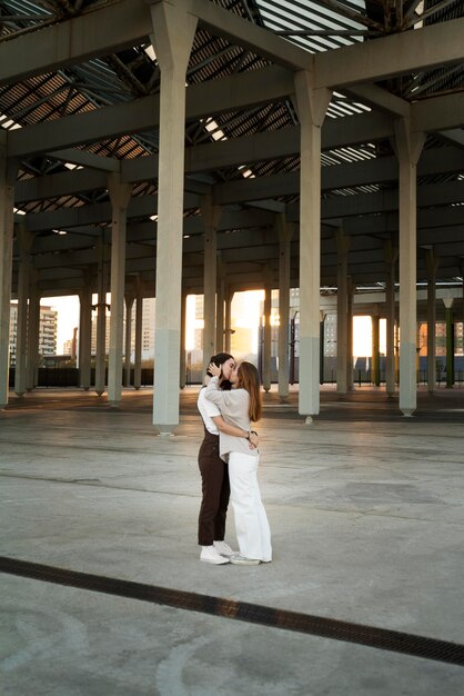 Adorable lesbian couple kissing outdoors