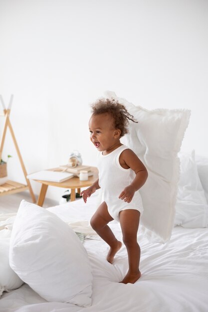 Adorable little black baby girl at home