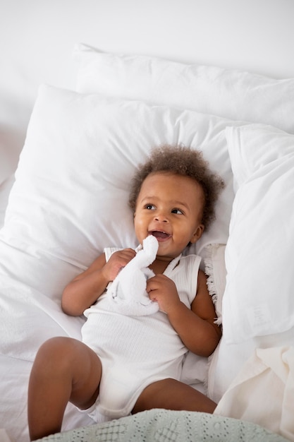 Adorable little black baby girl at home