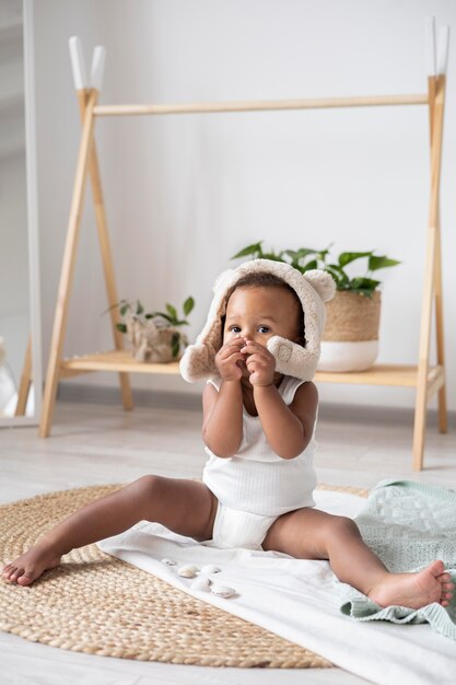 Adorable little black baby girl at home