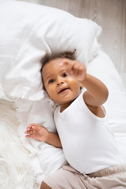 Adorable little black baby girl at home