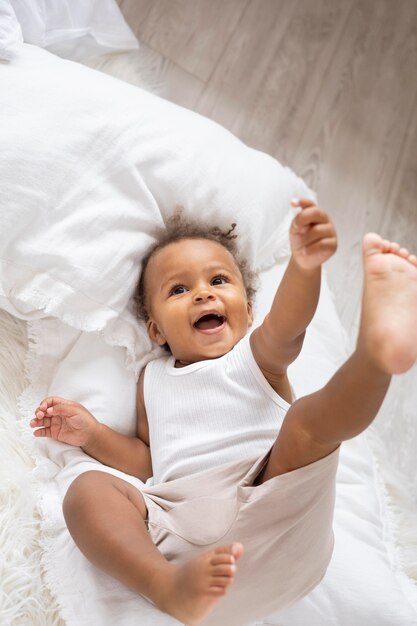 Adorable little black baby girl at home