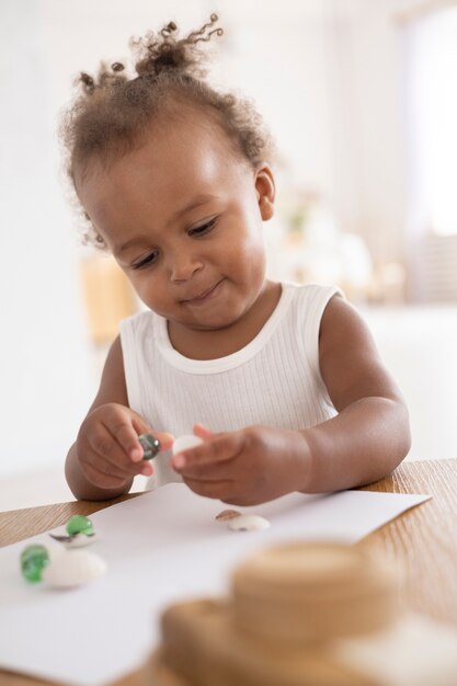 Adorable little black baby girl at home