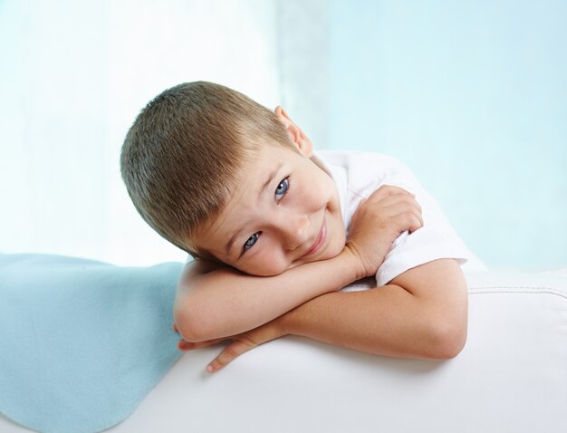 Adorable little boy on the sofa