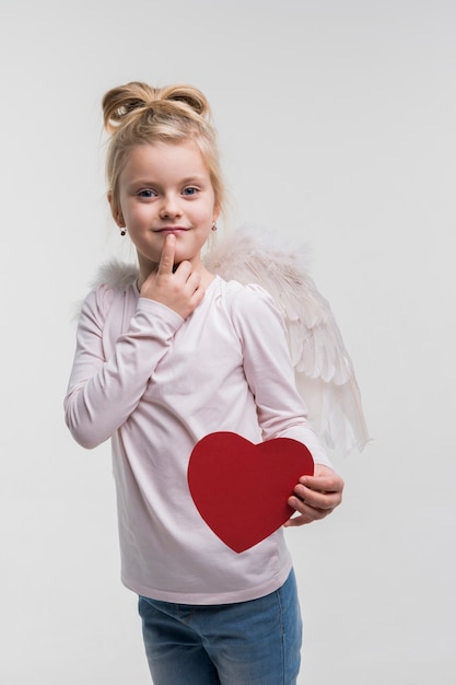 Adorable little girl dressed up as an angel