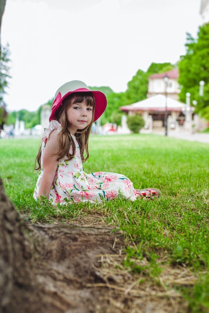 Adorable little girl smiling in a park