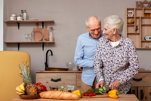 Adorable mature couple in the kitchen