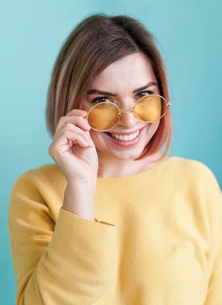 Adorable model holding glasses