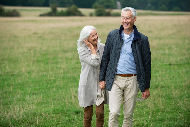 Adorable senior couple being affectionate while taking a walk