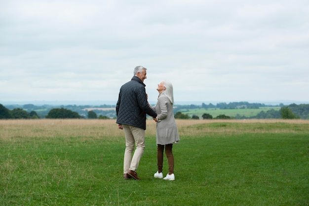 Adorable senior couple being affectionate while taking a walk