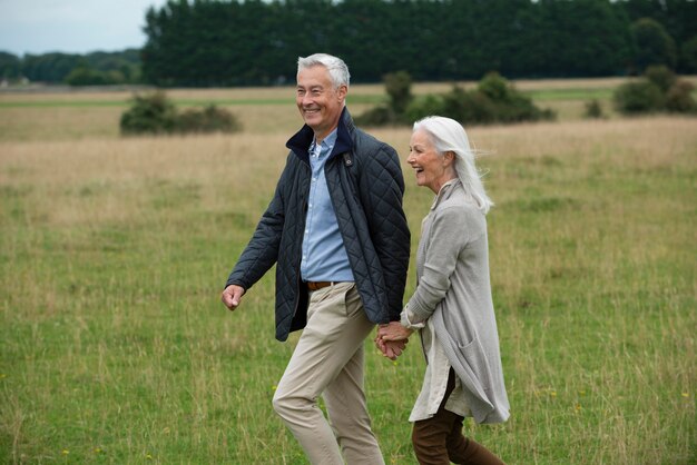 Adorable senior couple being affectionate while taking a walk